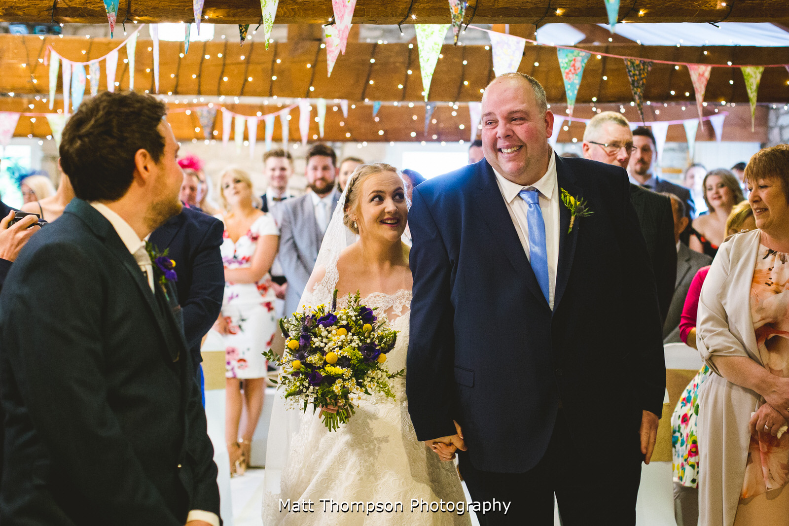 bride and her dad walking down the isle