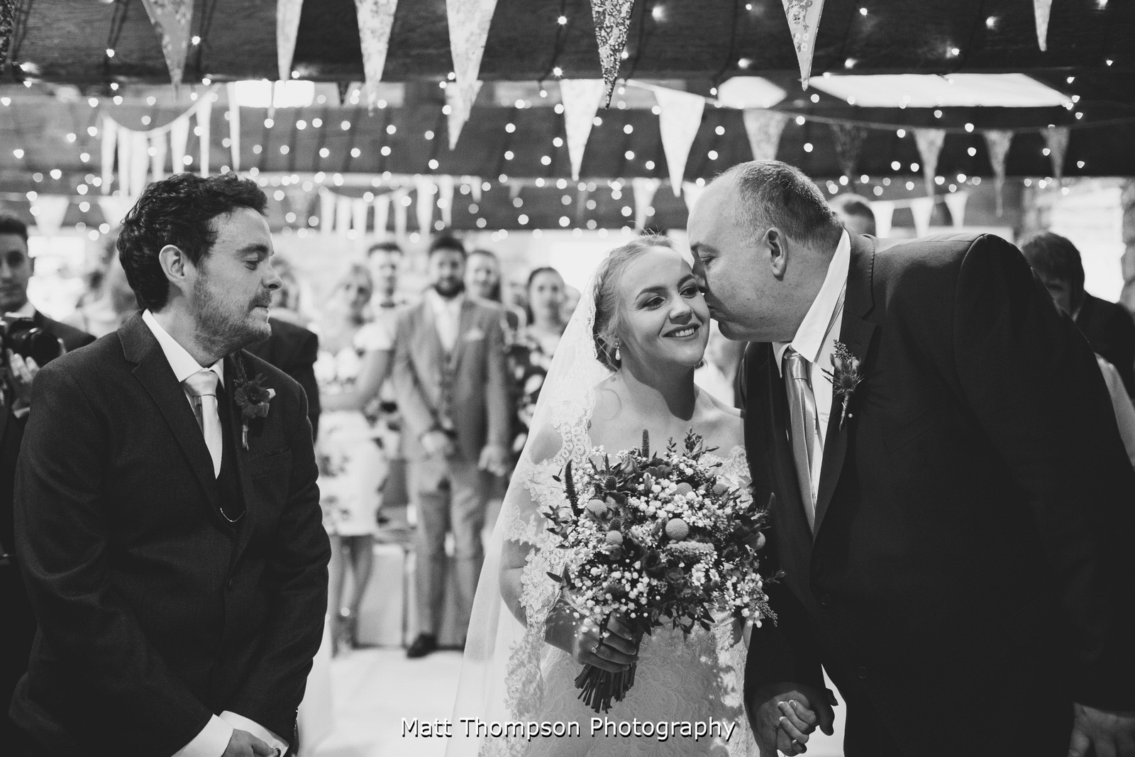 dad kissing his daughter