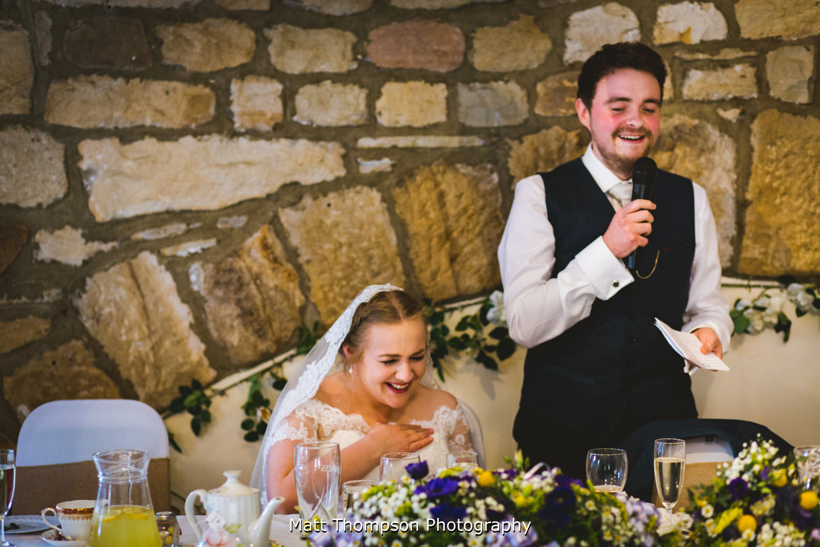 groom making the bride laugh