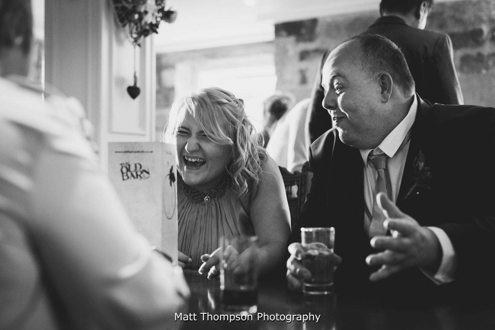wedding guests laughing
