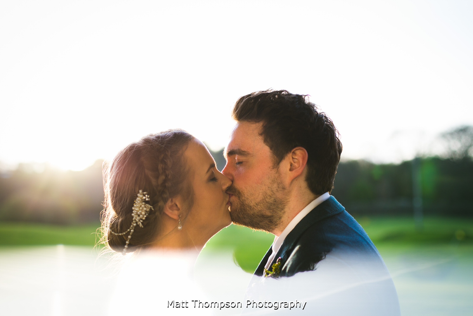 bride and groom kiss