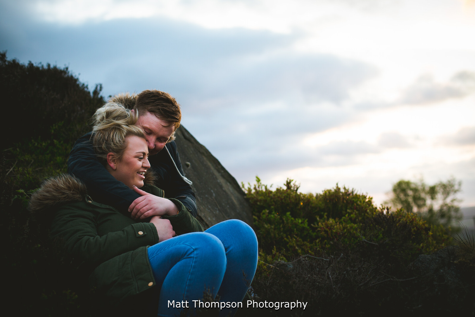 laughing sitting down