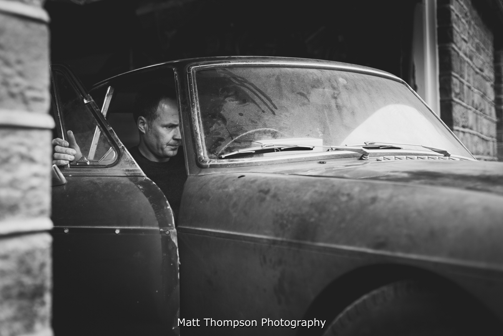 groom working on his wedding car