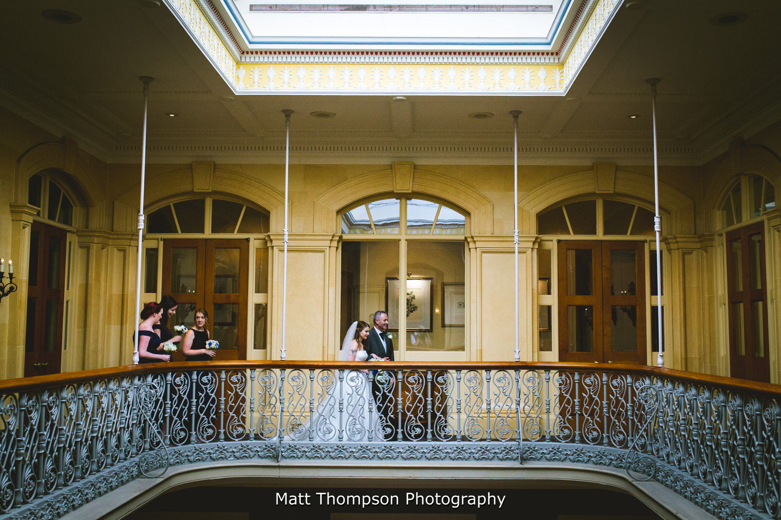 bride on the balcony at oulton hall