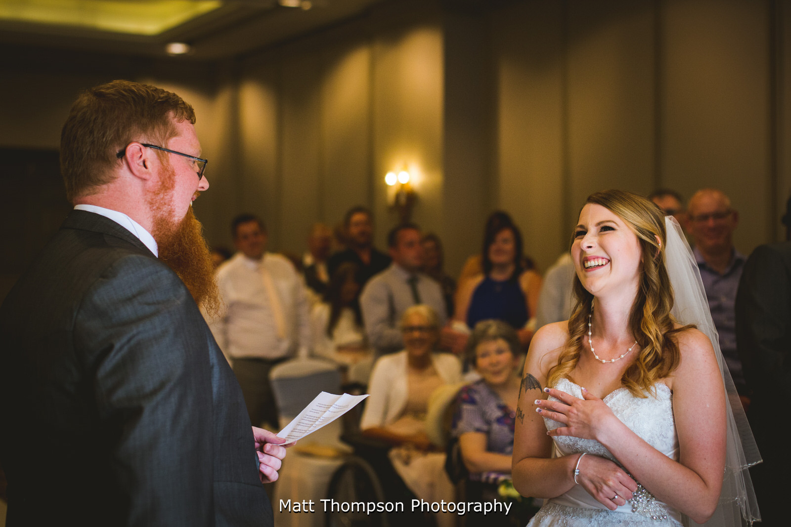 bride laughing at ceremony