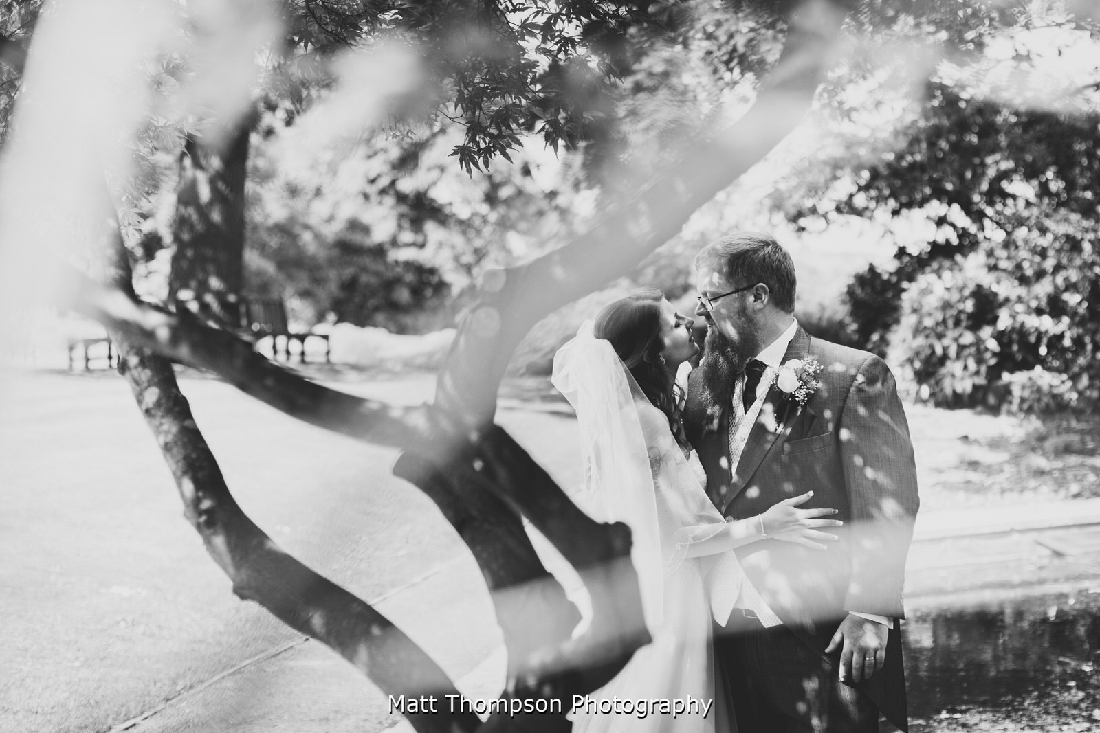 black and white wedding kiss