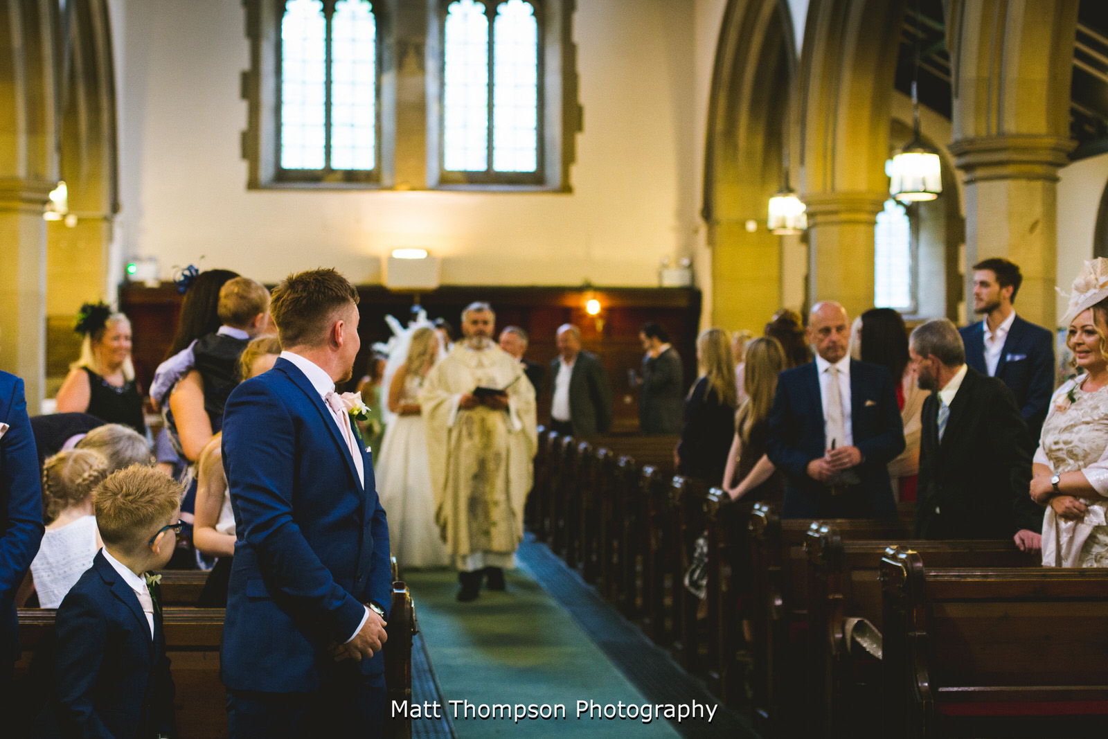 bride walking up the church isle