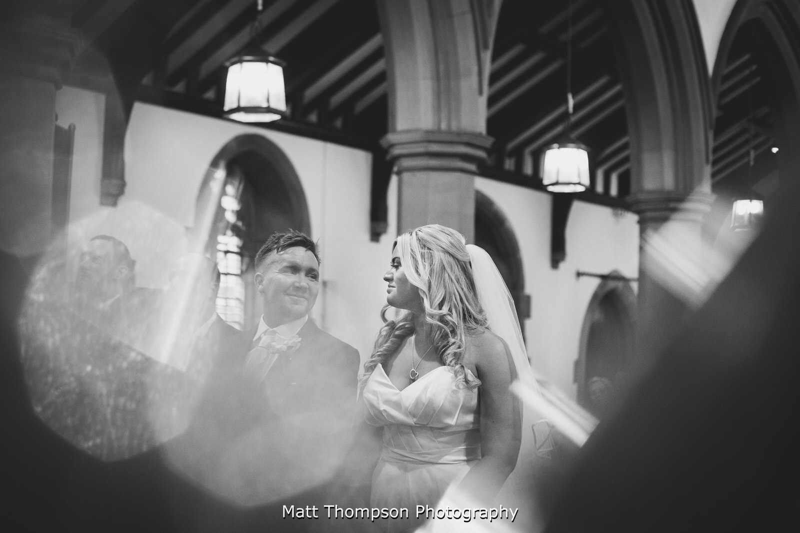 bride and groom looking at each other at st judes church in halifax
