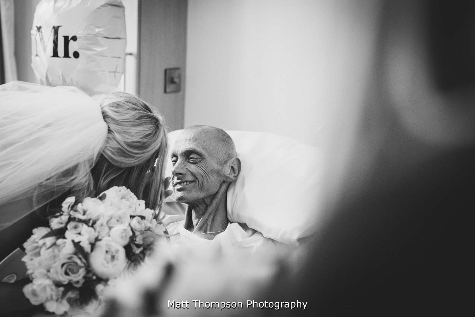 father of the bride smiling