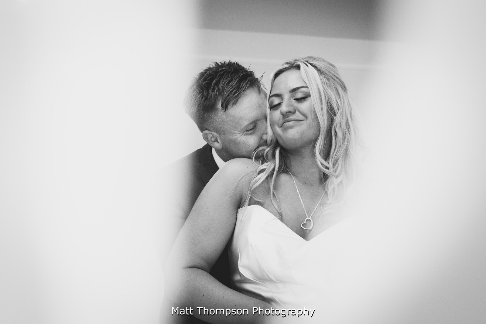 bride and groom cuddles