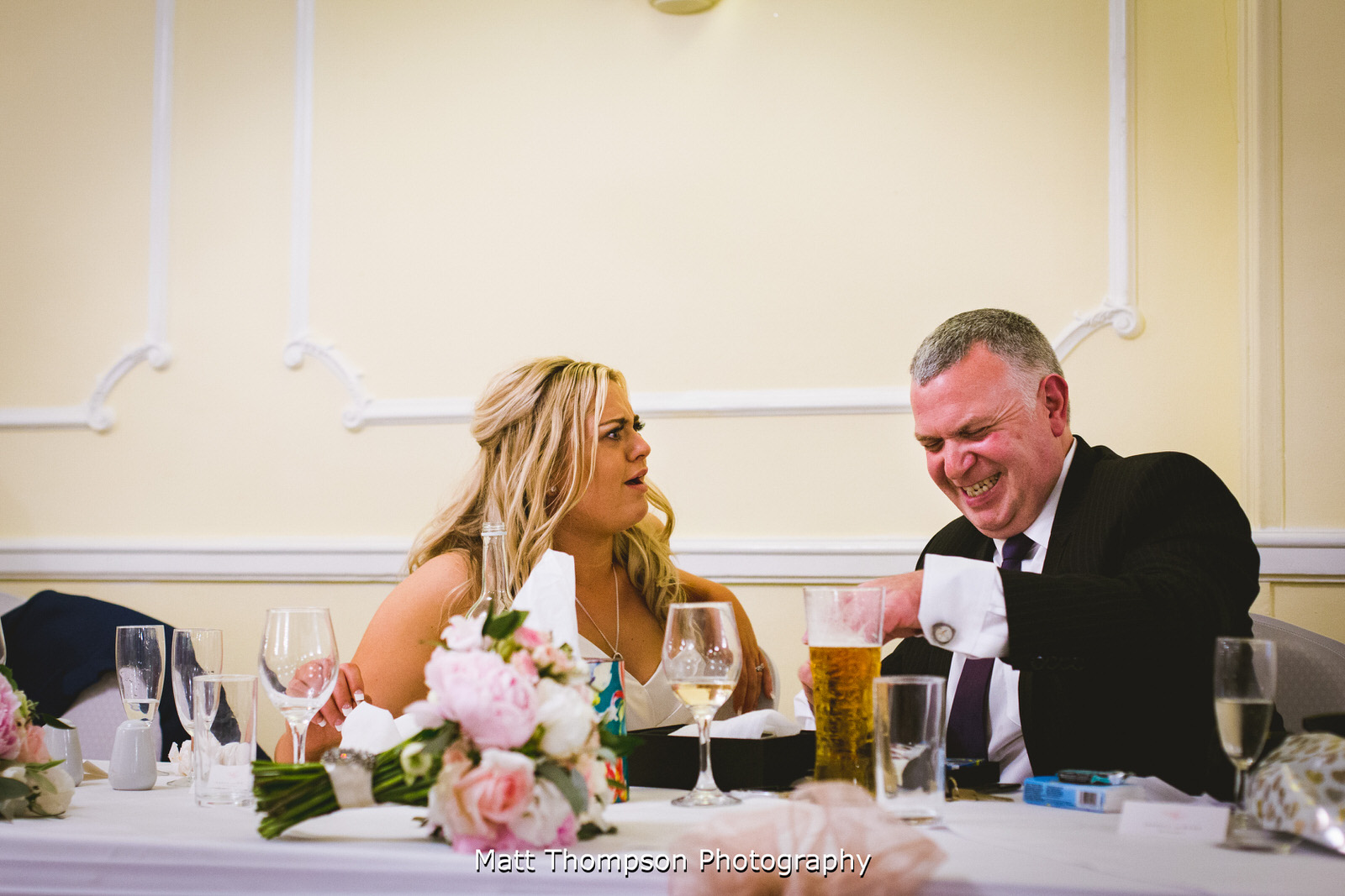 laughing at a wedding