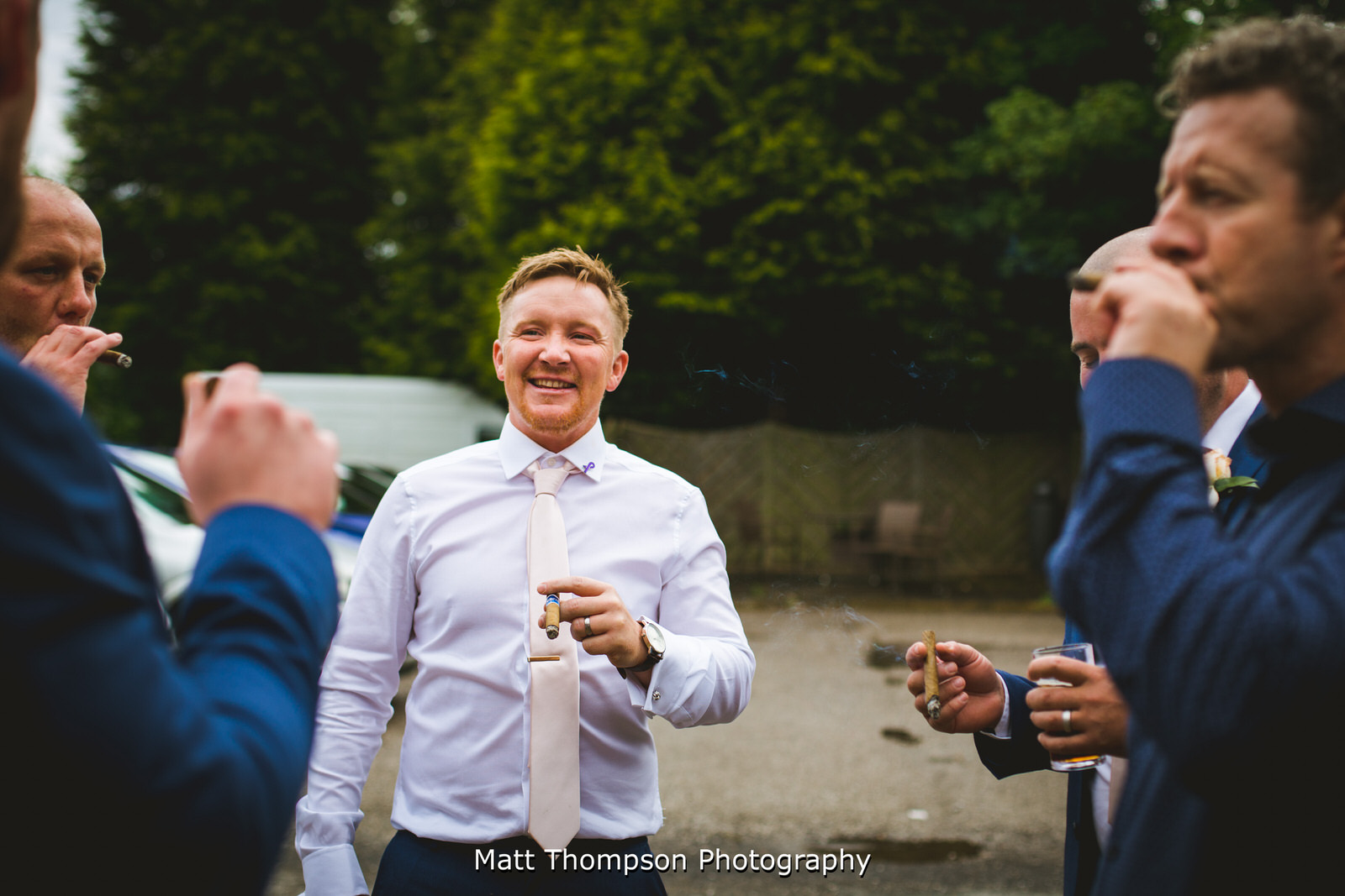 groomsmen with cigars