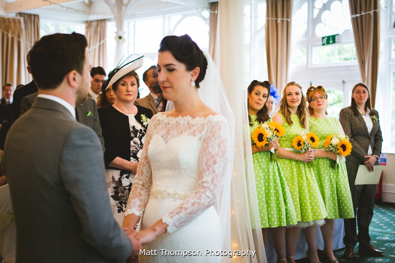 bridesmaids looking during ceremony