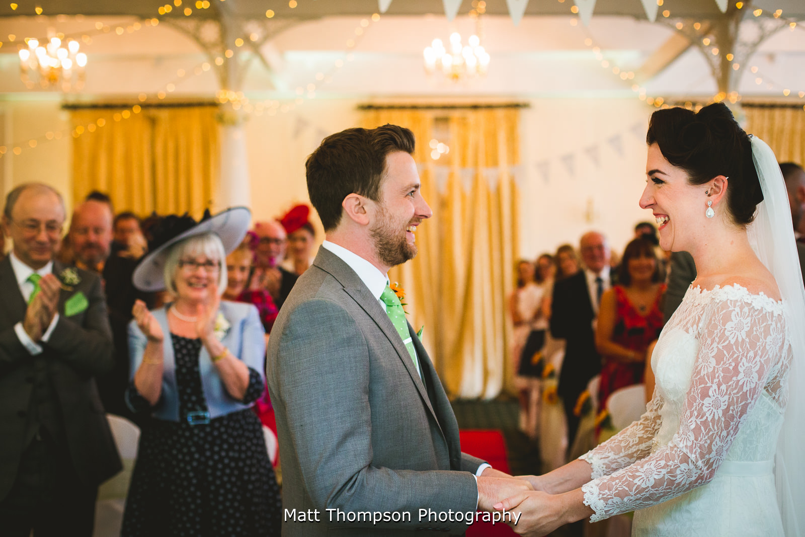 bride and groom smiling at each other