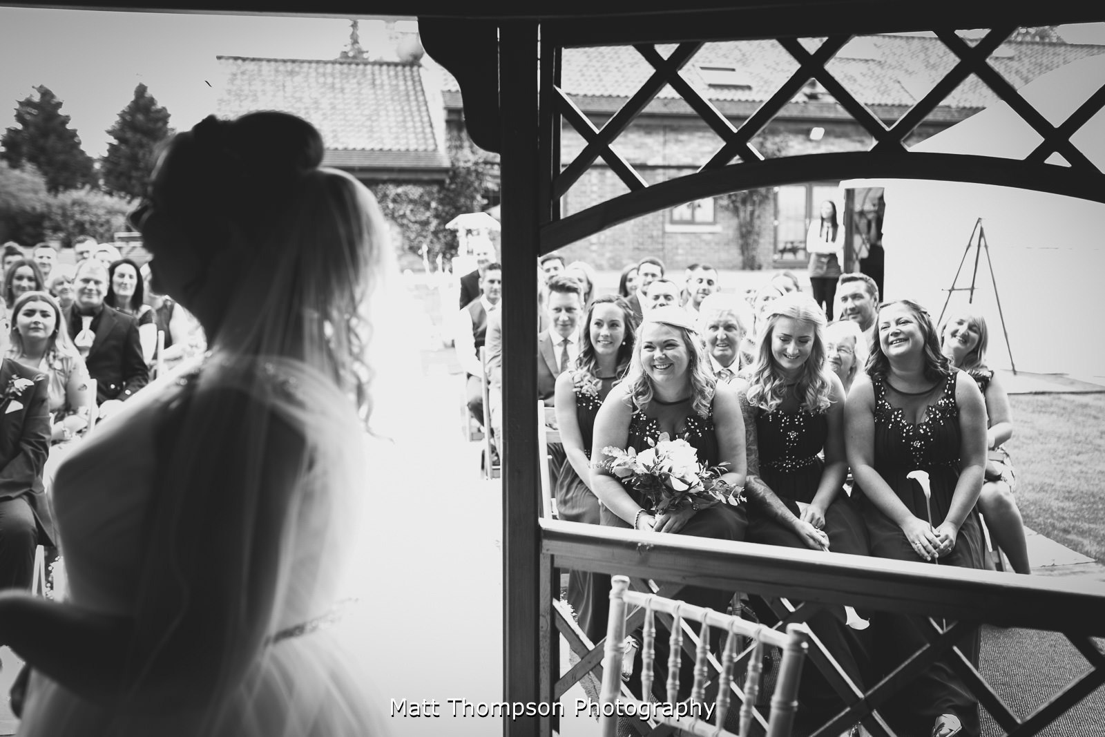 bridesmaids watching ceremony