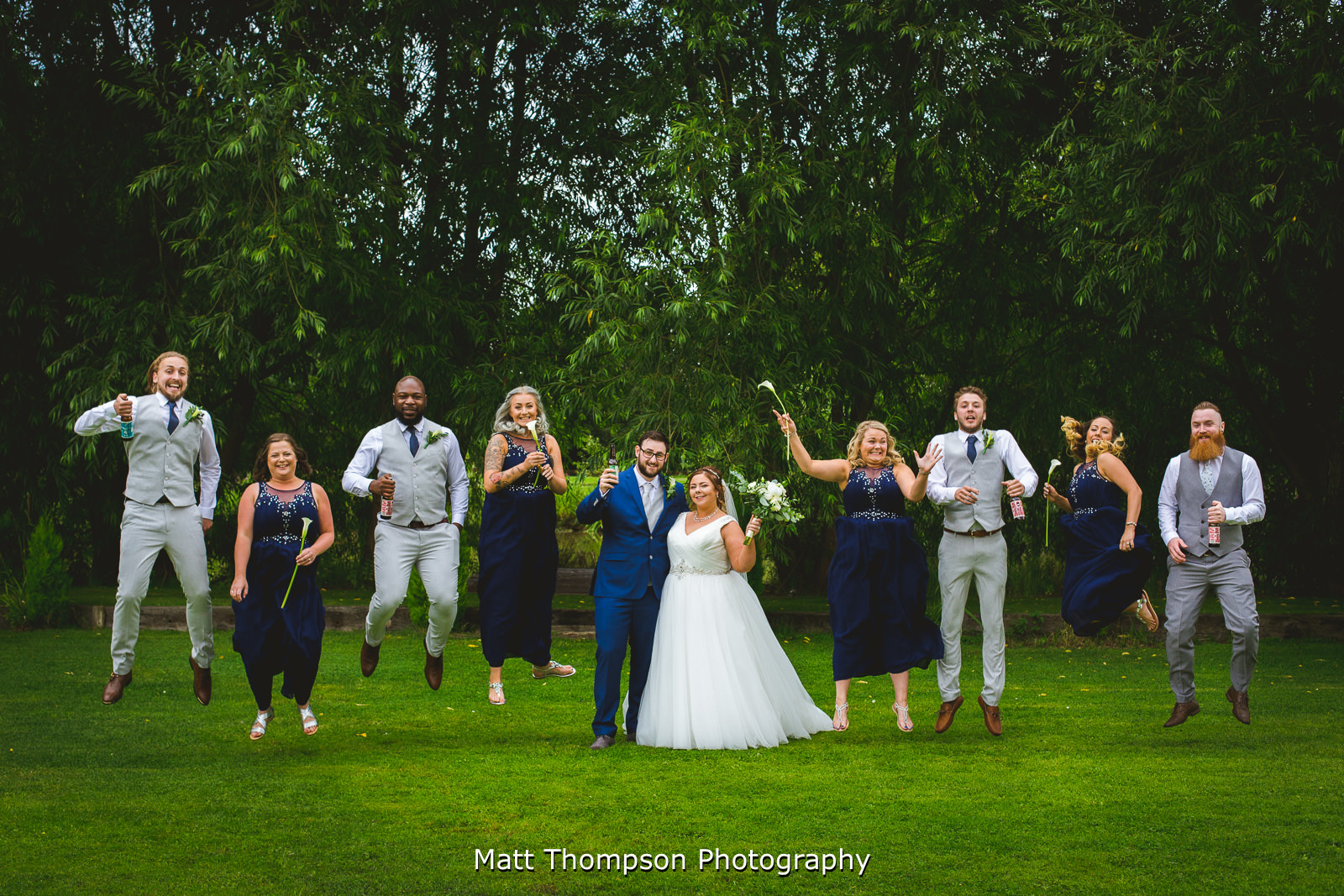 bridesmaids and groomsmen jumping photo