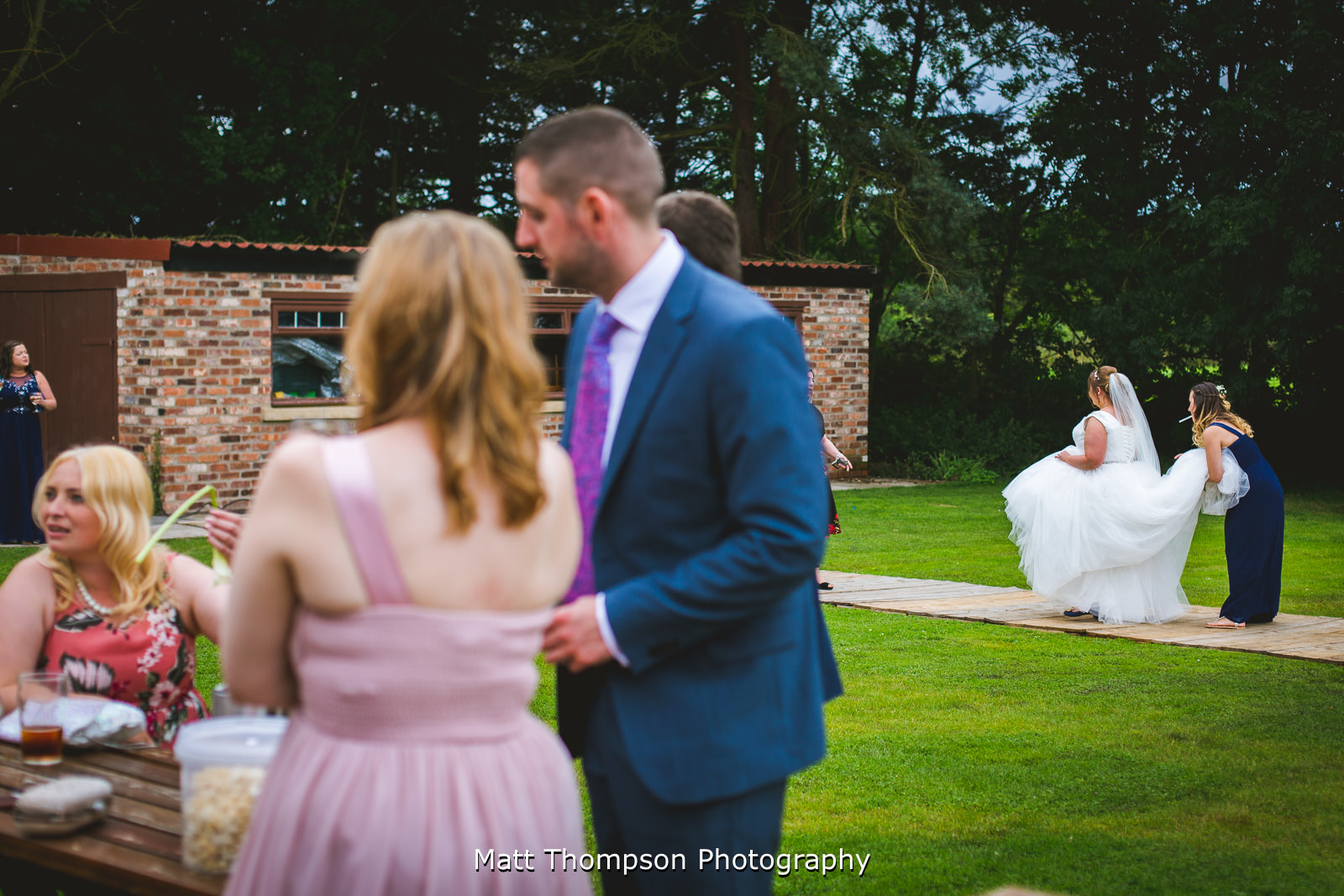 helping bride to the toilet