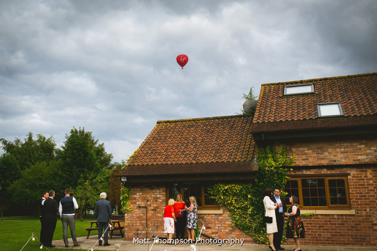 hot air balloon over villa farm