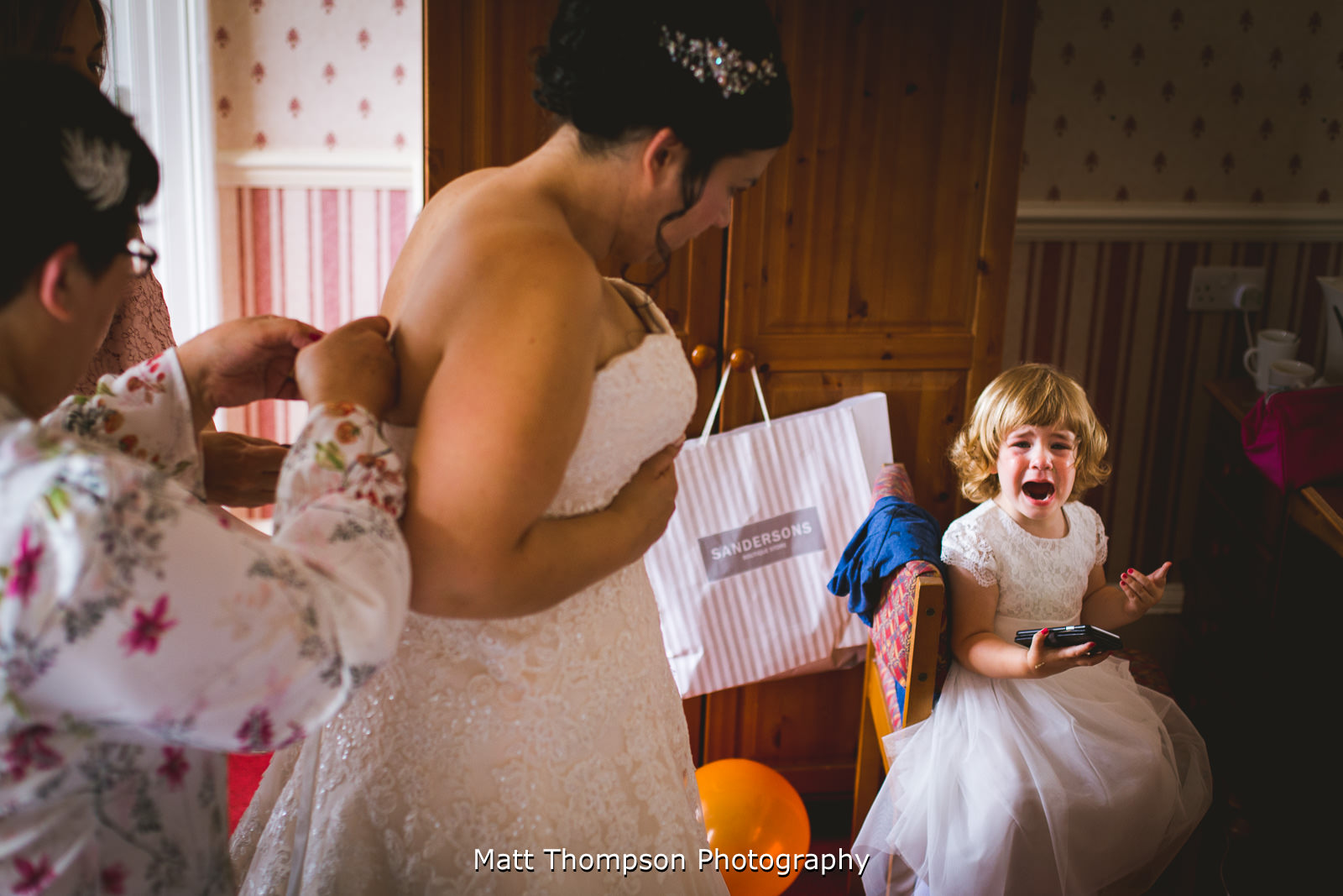 crying child and wedding dress