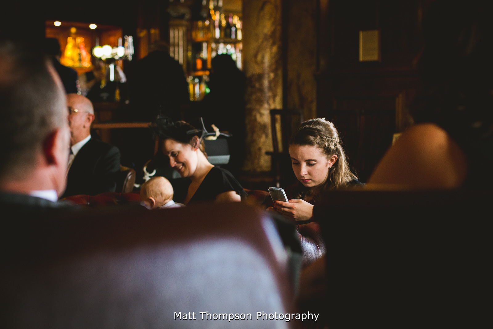 playing on mobile phone at bar