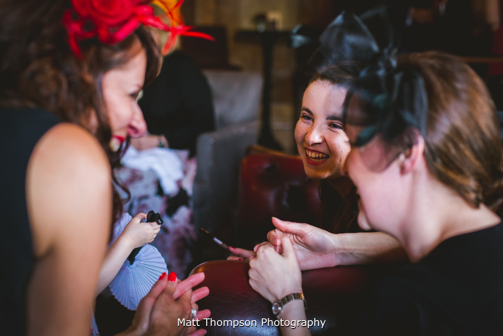 girls laughing at a wedding