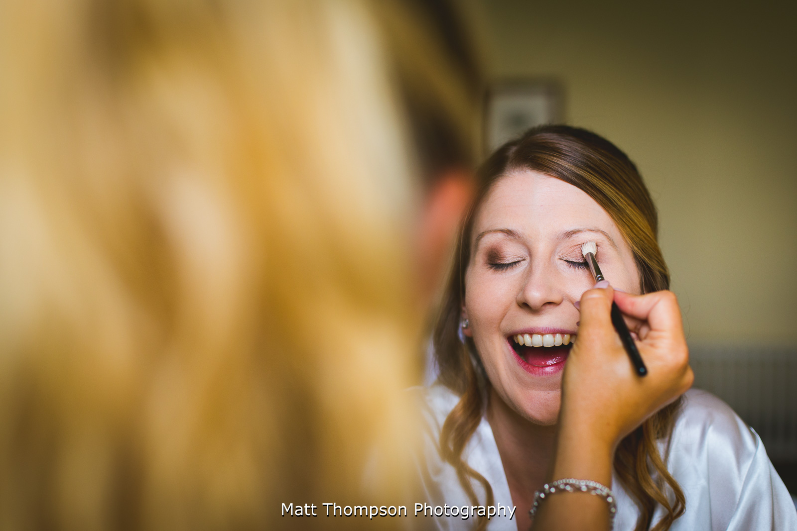 smiling during bridal prep