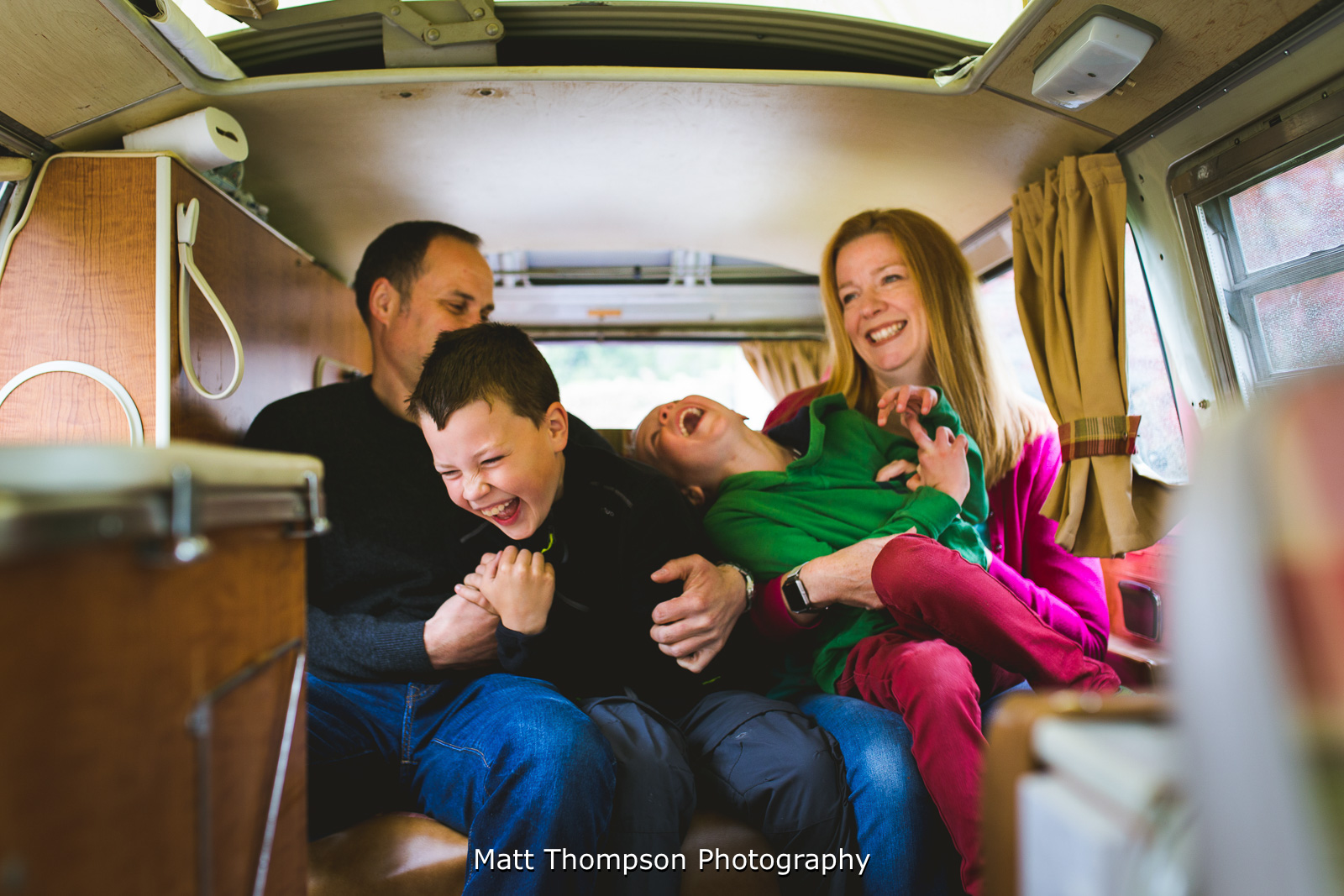 family in a campervan