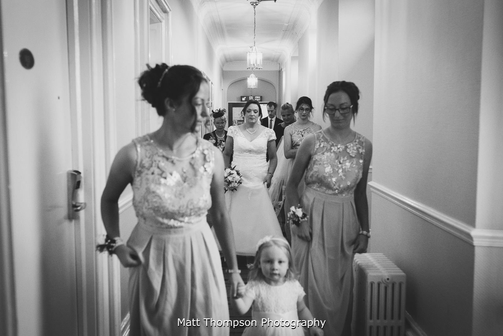bride walking with bridesmaids