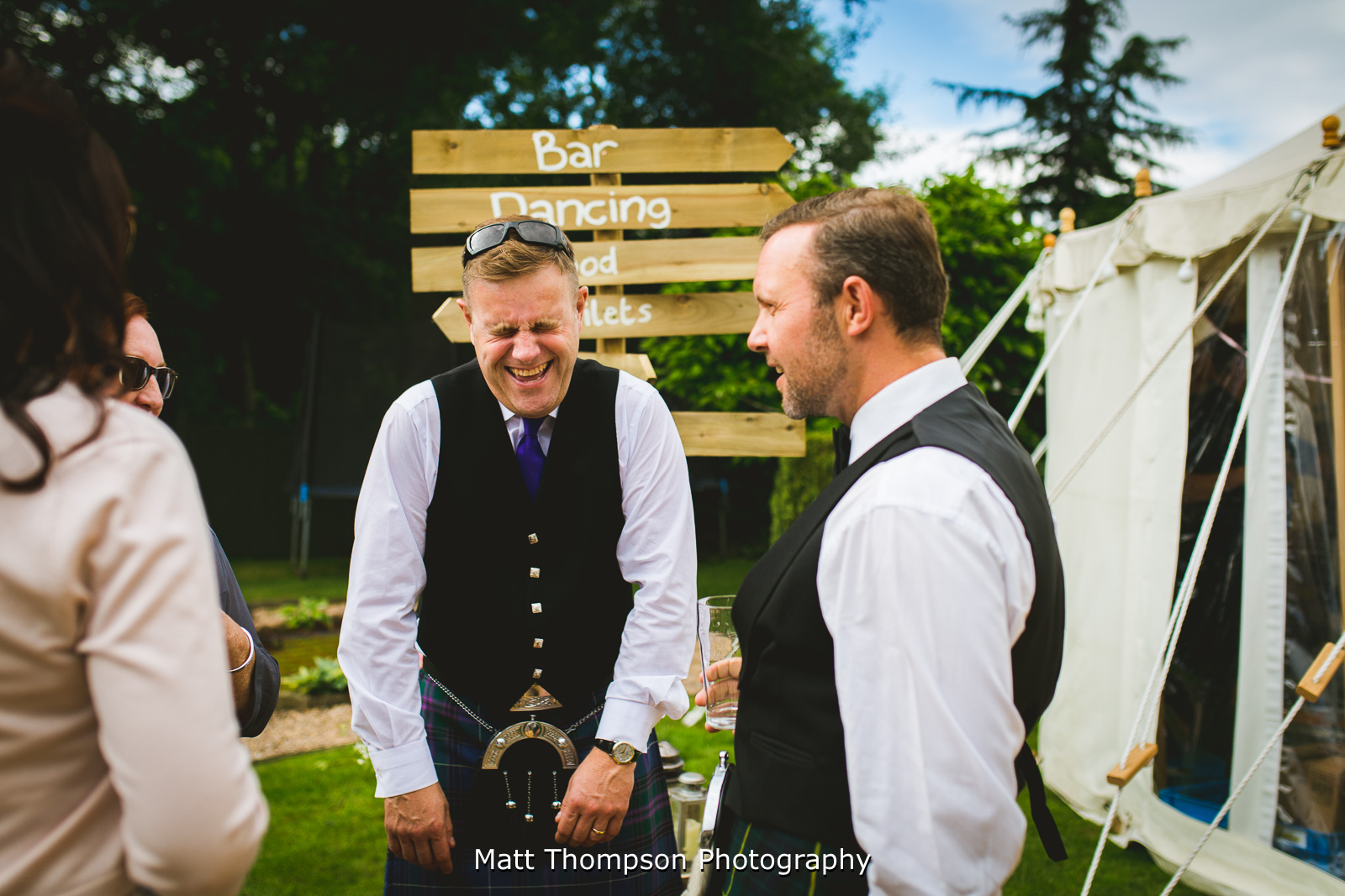 wedding guests laughing