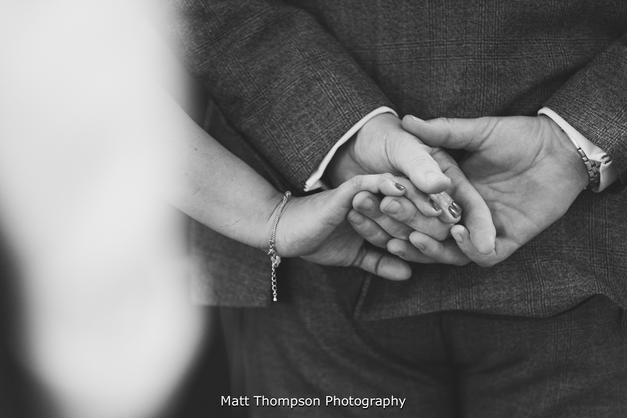 holding hands at wedding