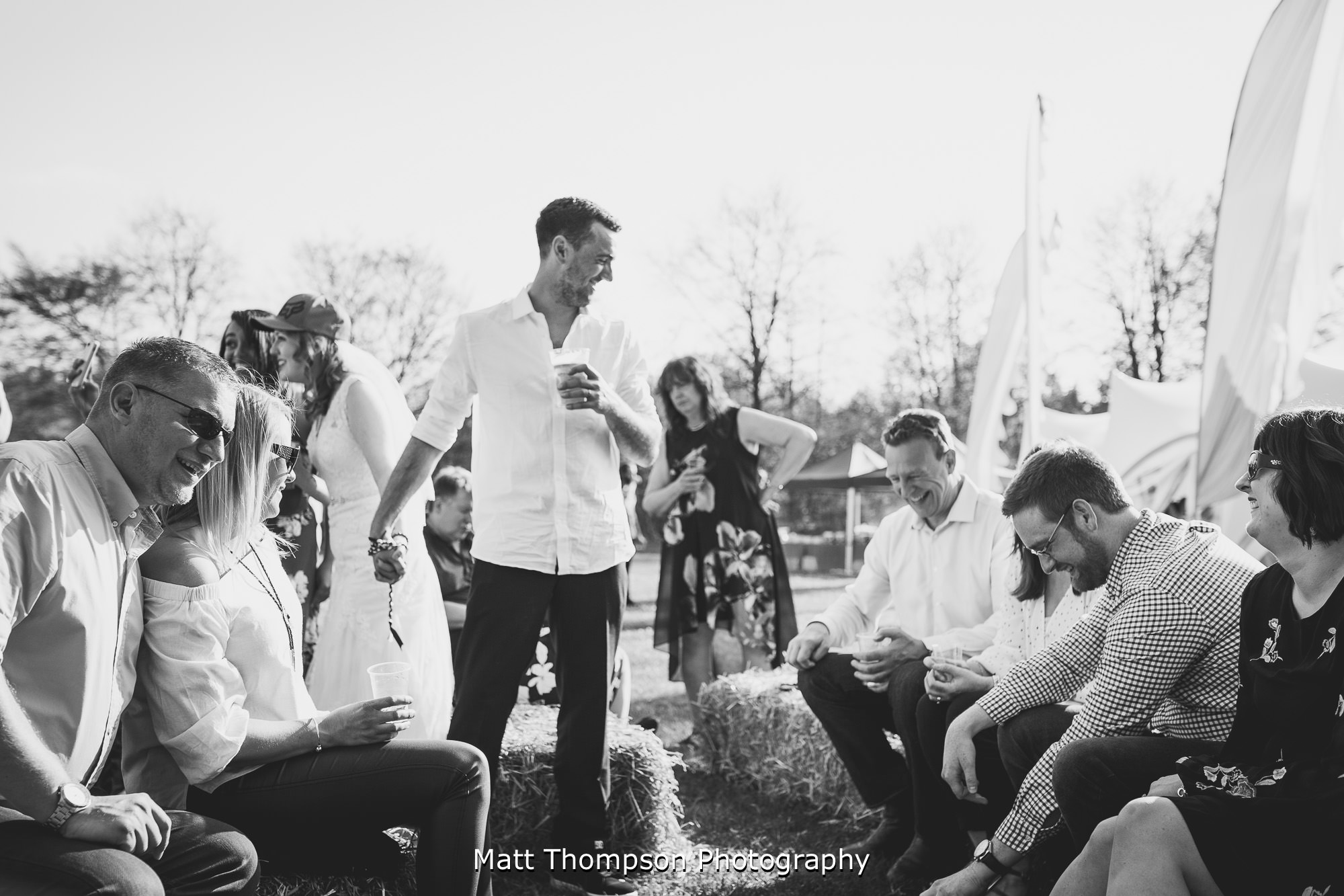bride and groom chatting to wedding guests