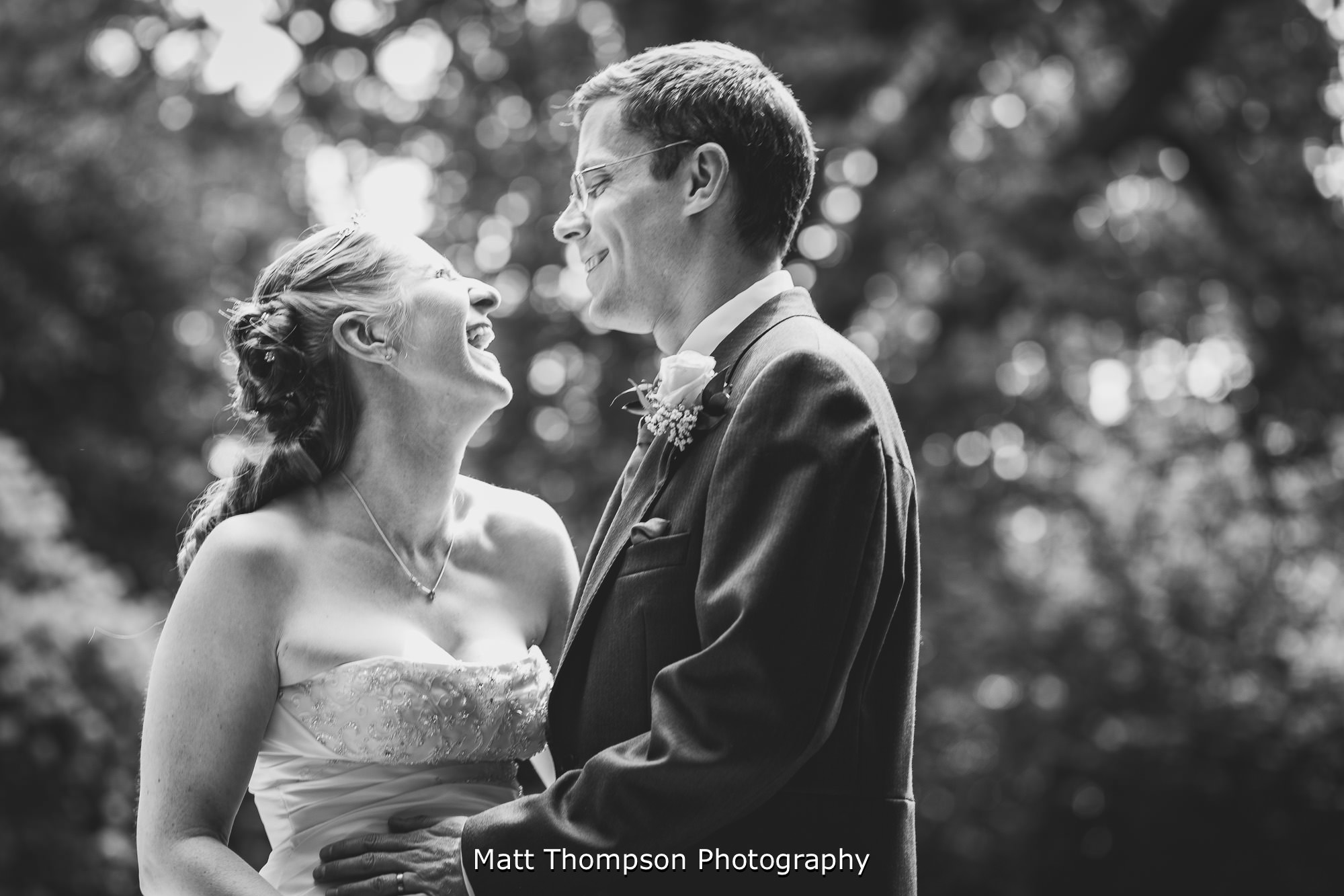 bride and groom laughing