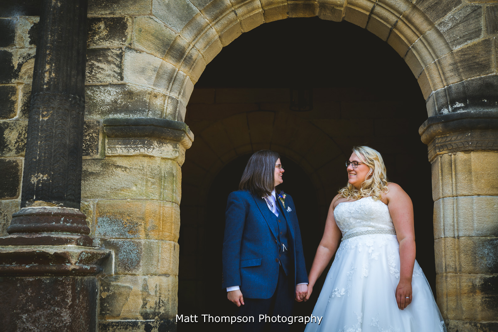 Bride and bride holding hands