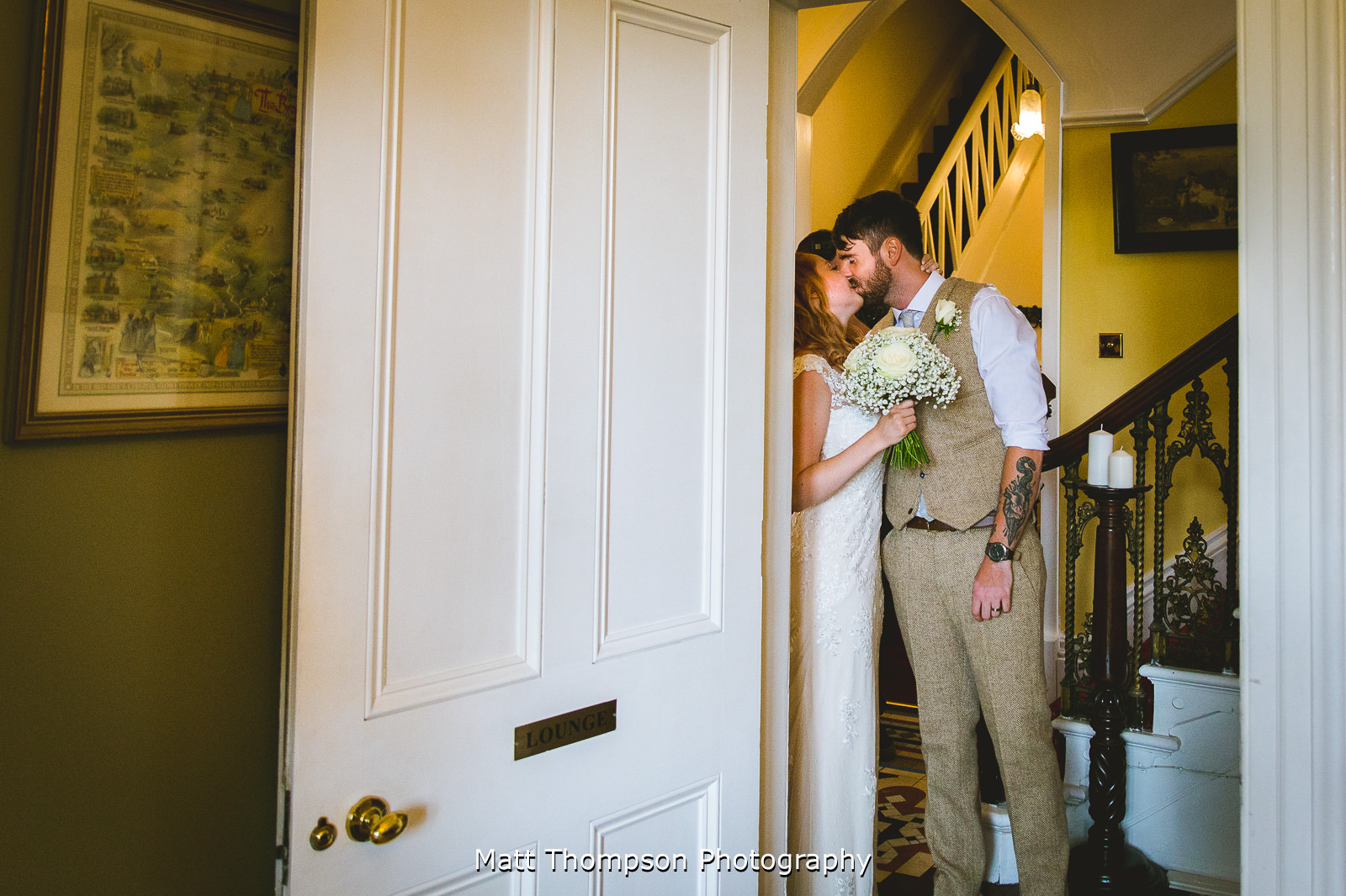 sneaky kiss at yorkshire wedding