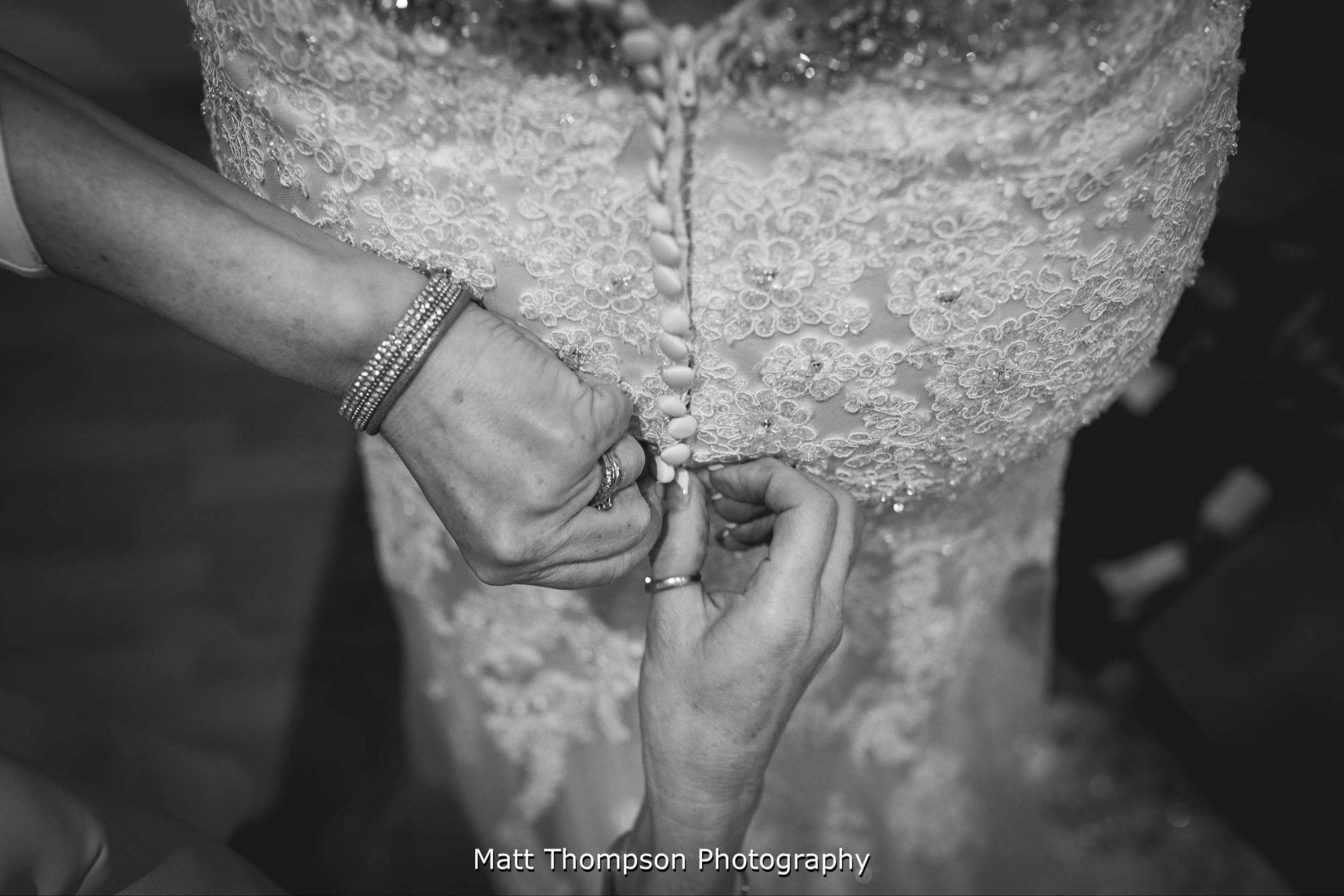 Buttoning up the dress