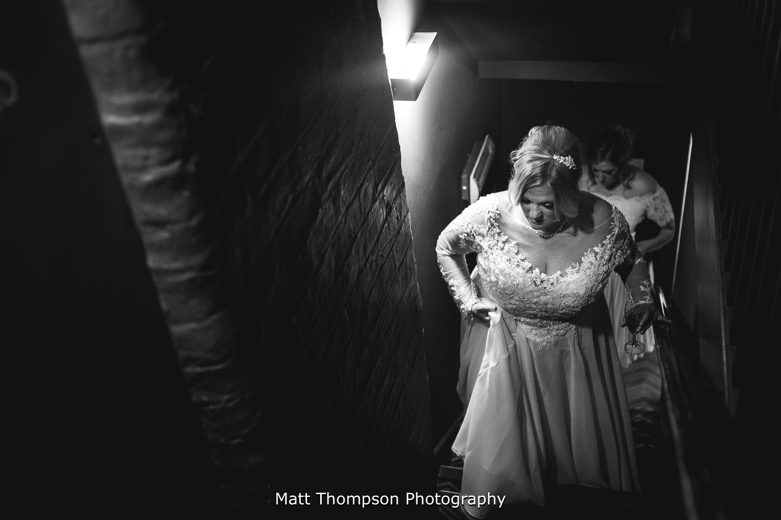 Bride walking up stairs