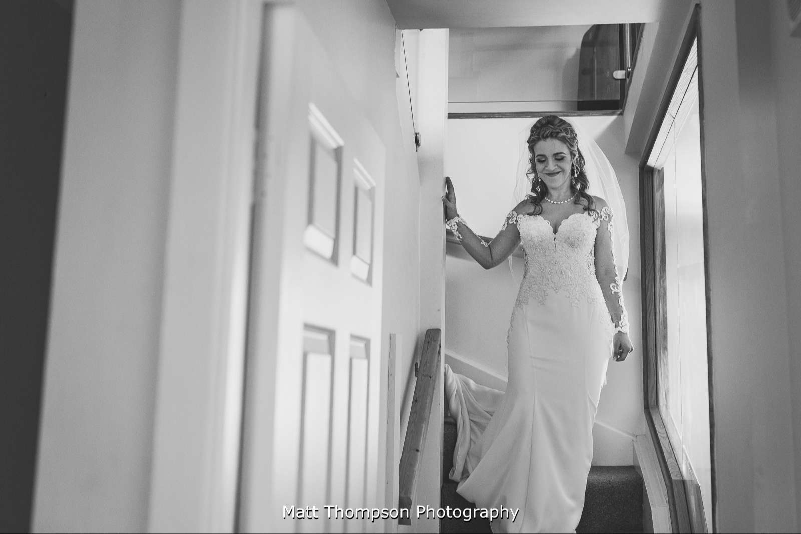 Bride coming down the stairs