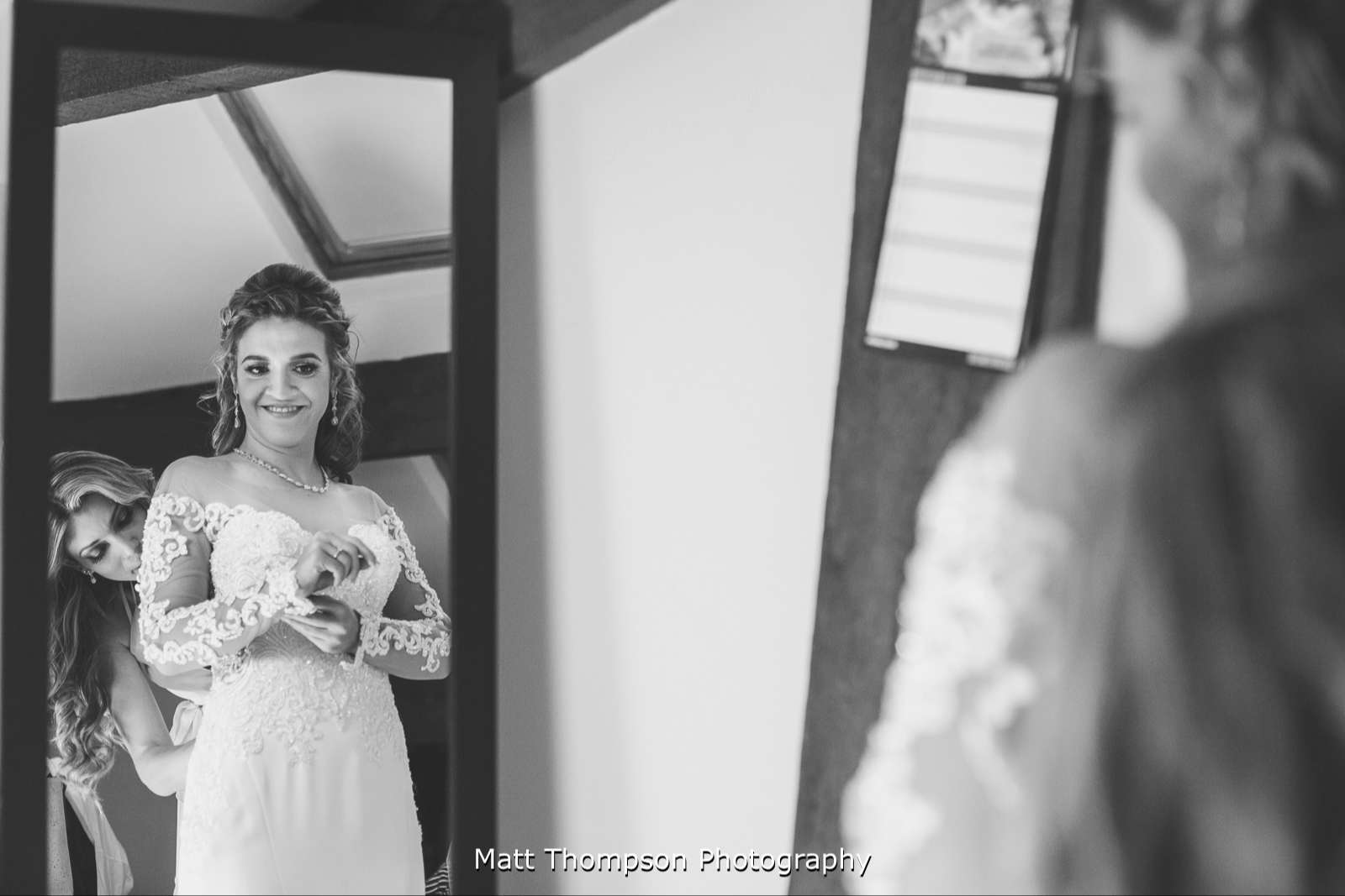 Putting wedding dress on