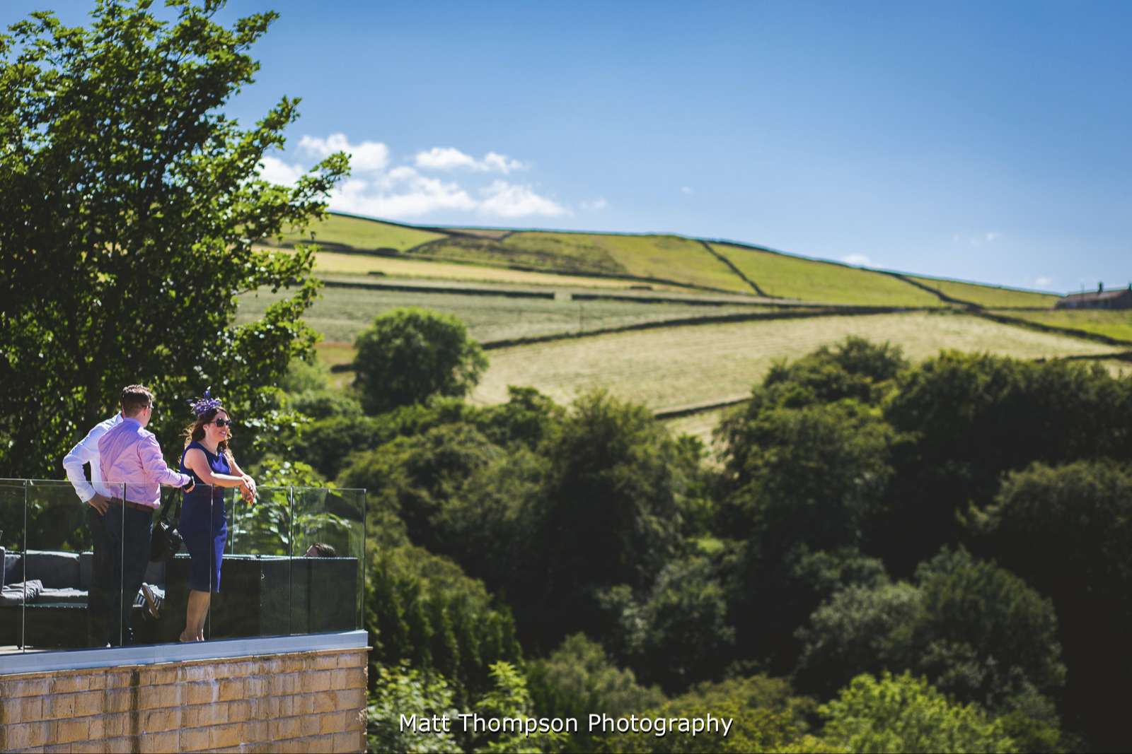 Wedding guest admiring the Holmfirth Vineyard view