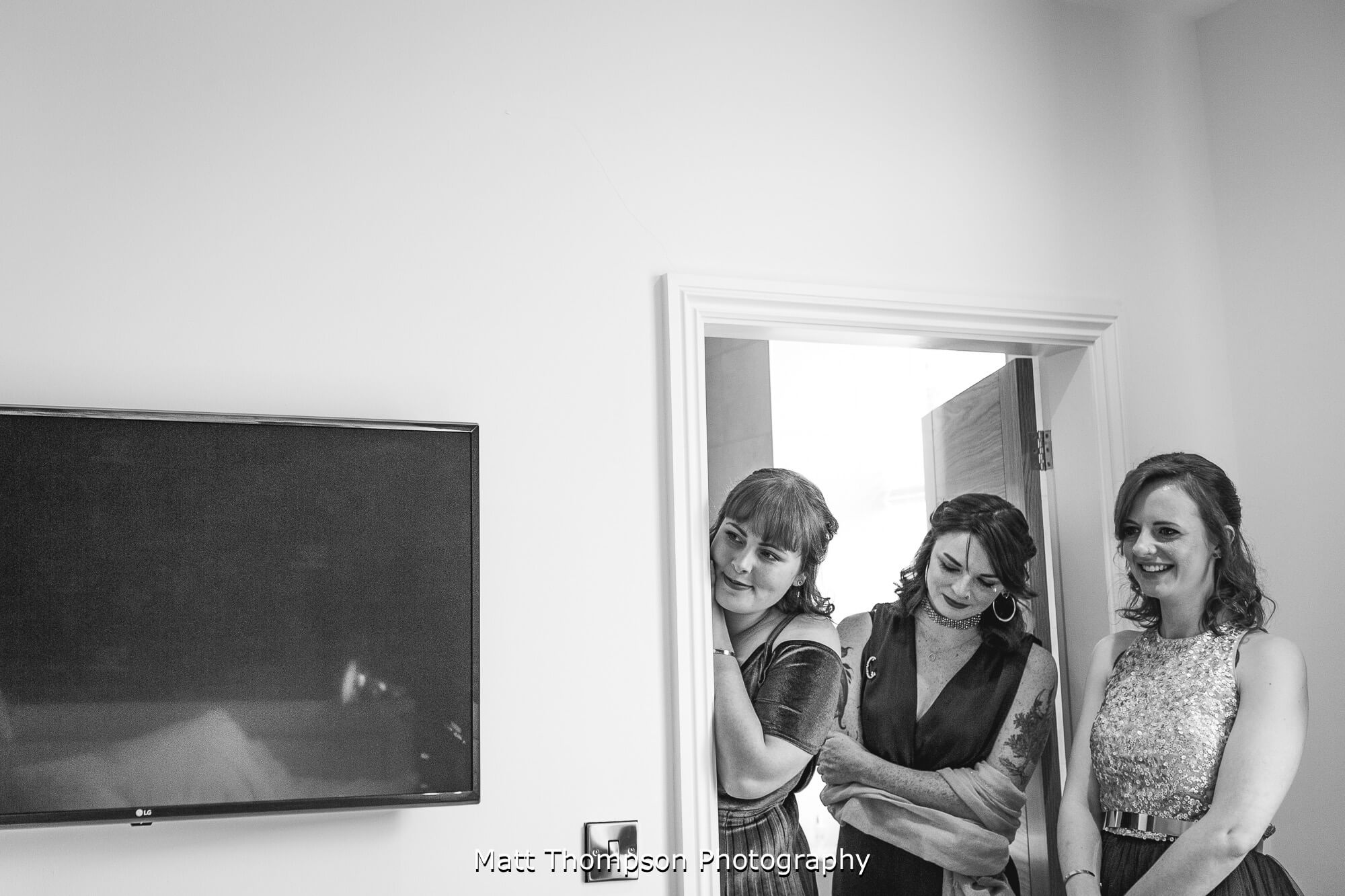 Bridesmaids looking on