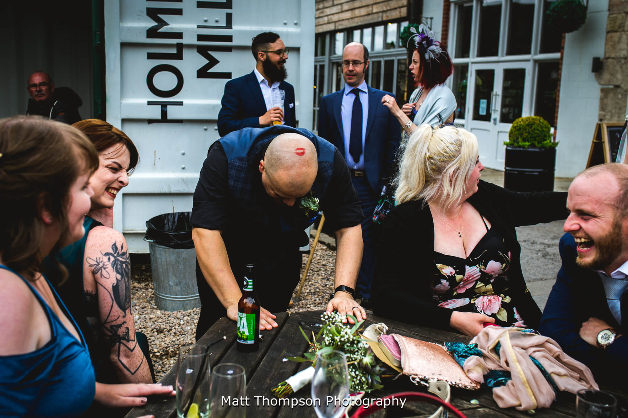 Wedding guests laughing