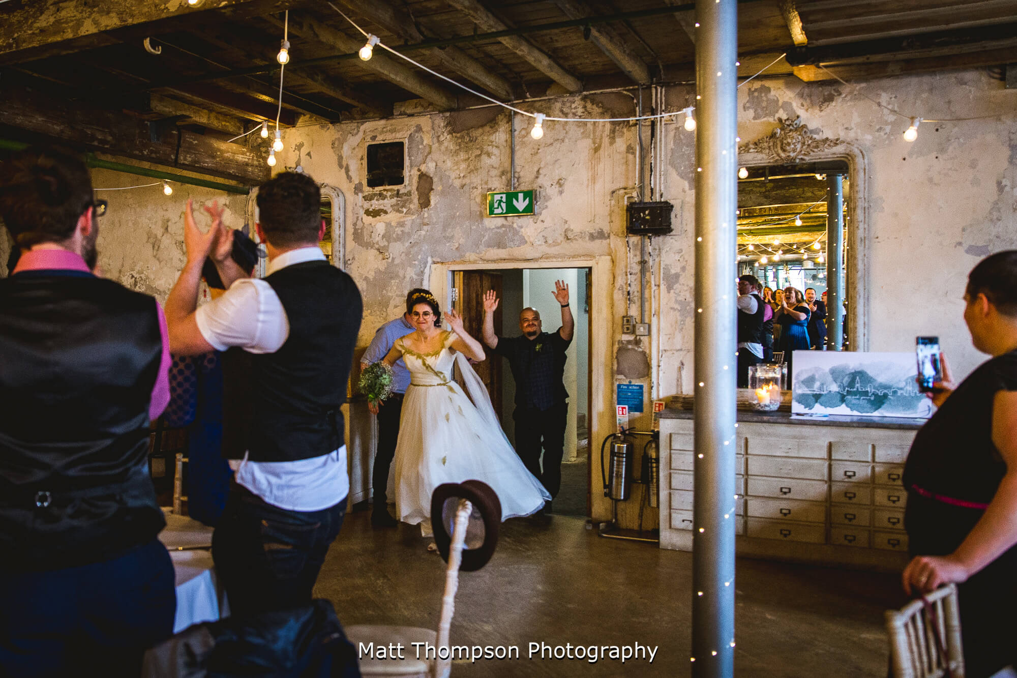 Bride and groom entering the wedding breakfast