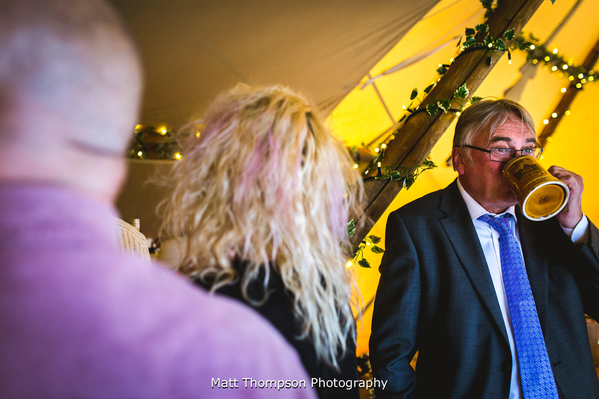 Wedding guest drinking