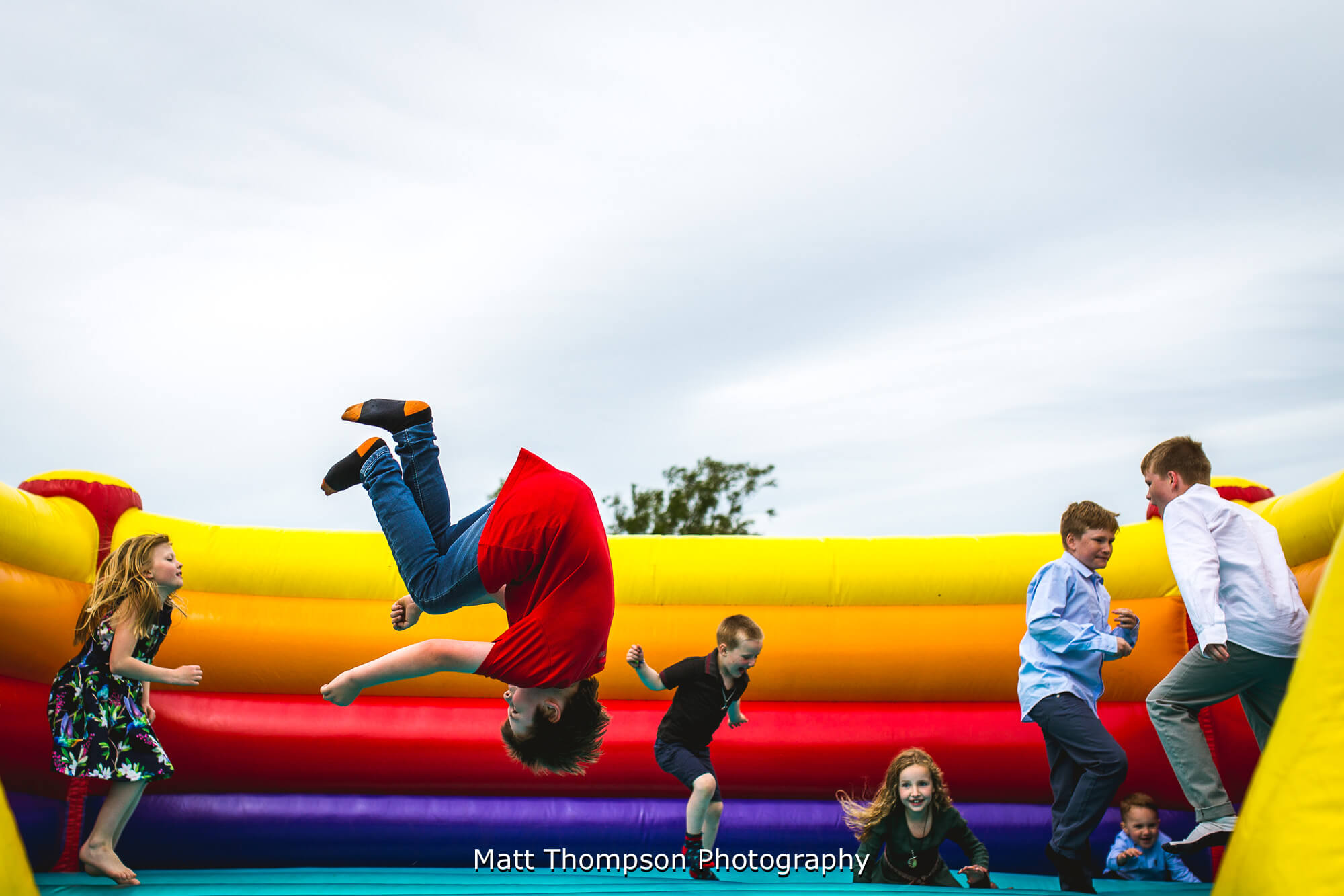 Kids on wedding bouncy castle