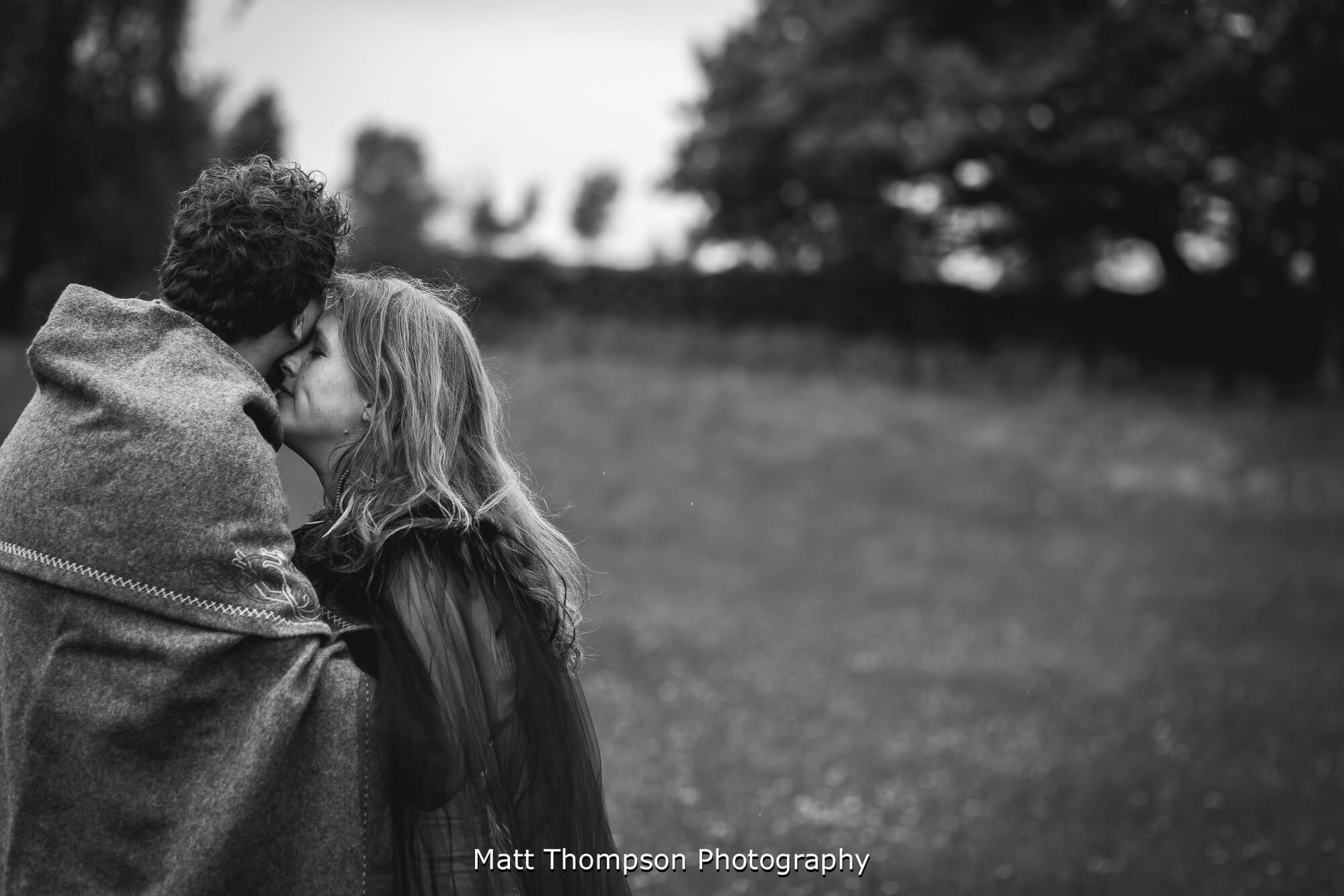 Bride and groom cuddling