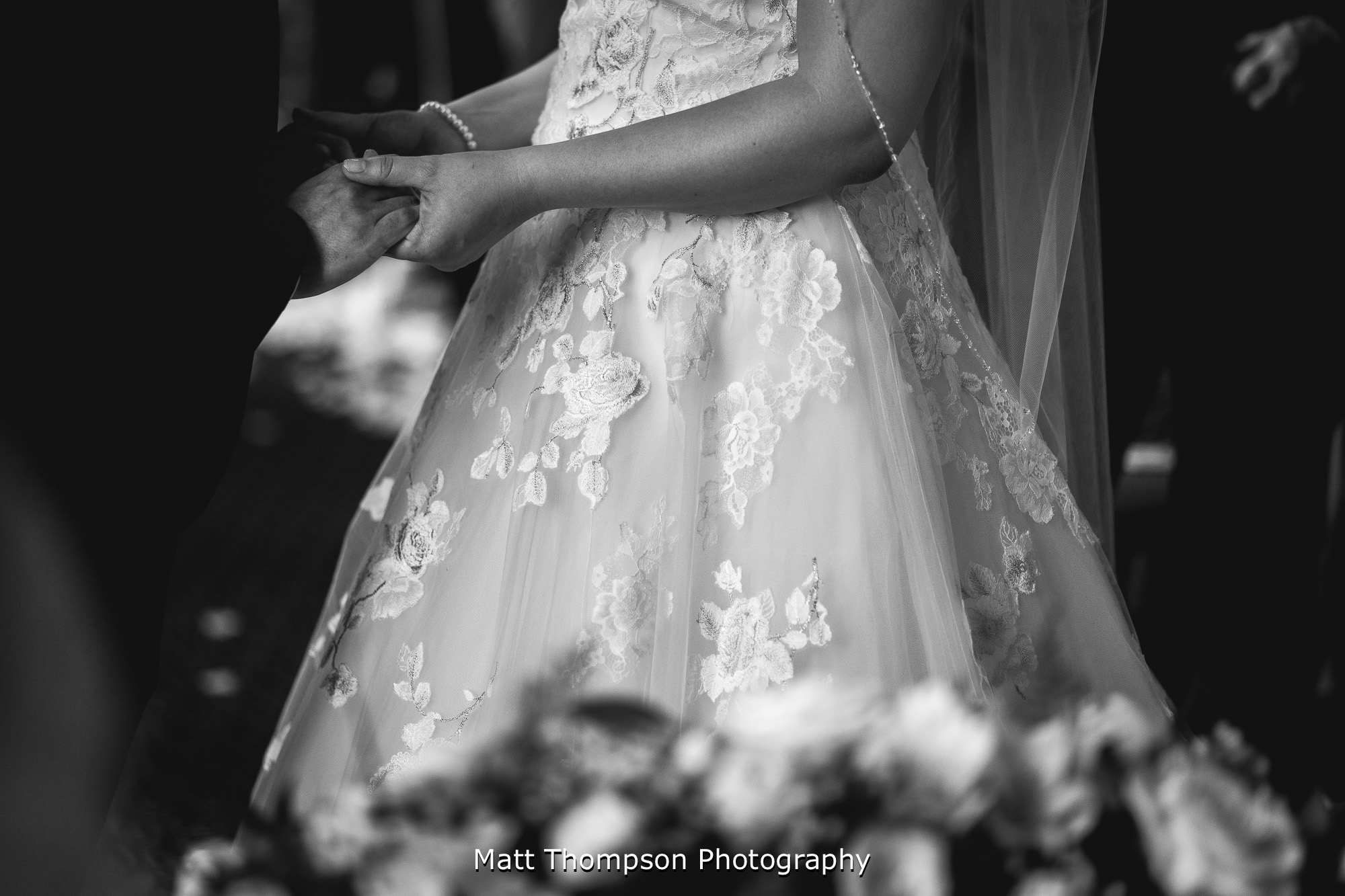 bride and groom holding hands
