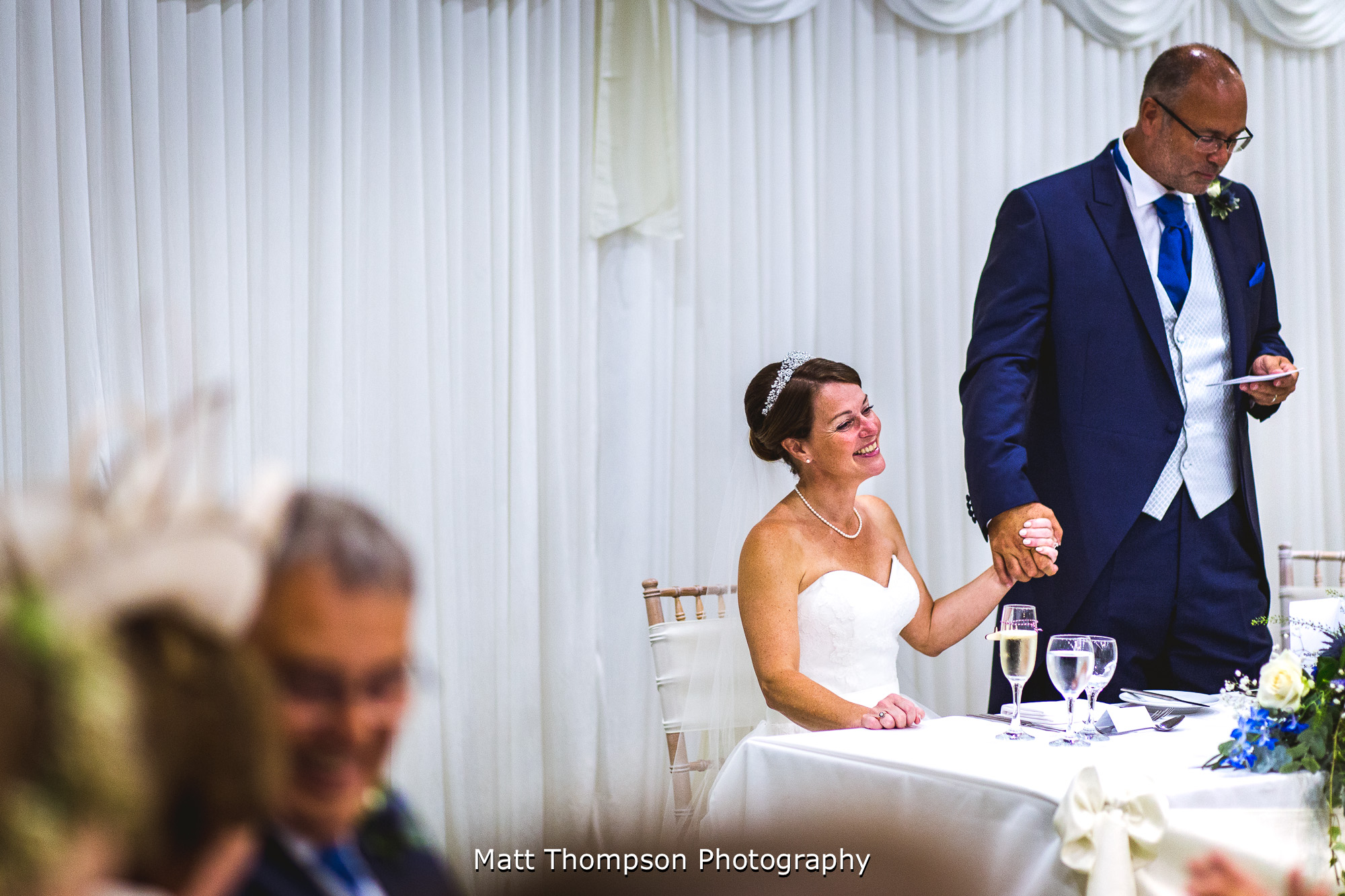 bride holding grooms hand at petwood hotel