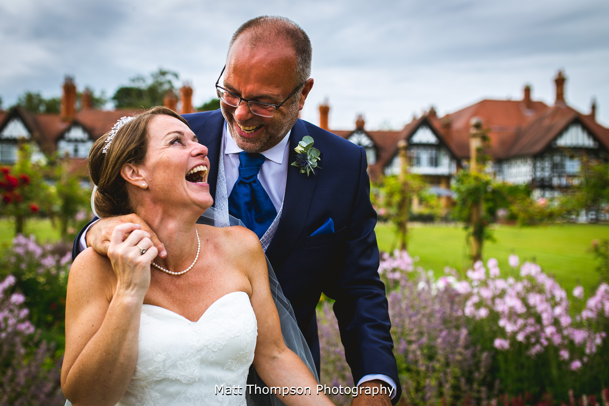 bride and groom laughing
