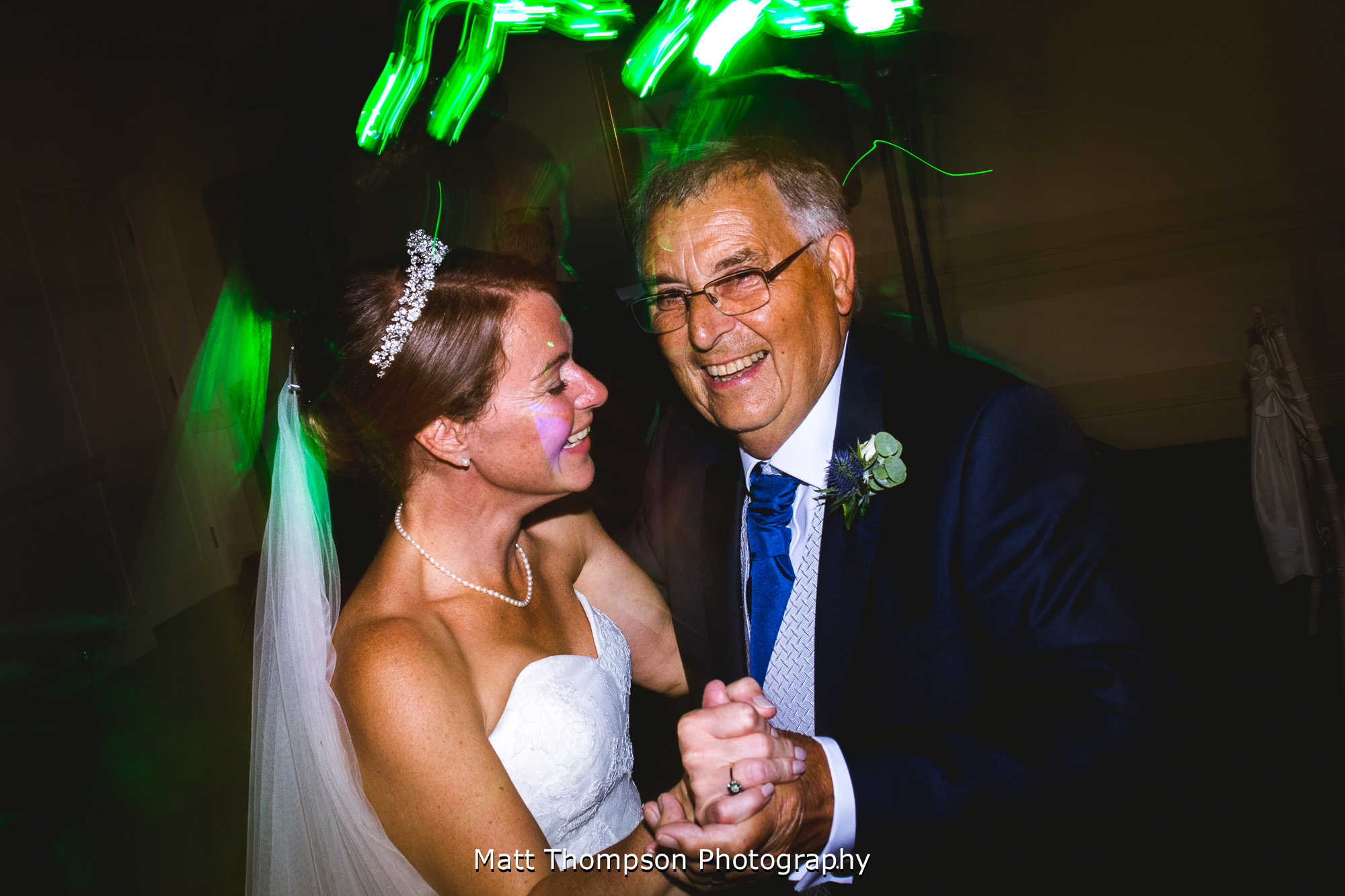 bride and father of the bride dancing