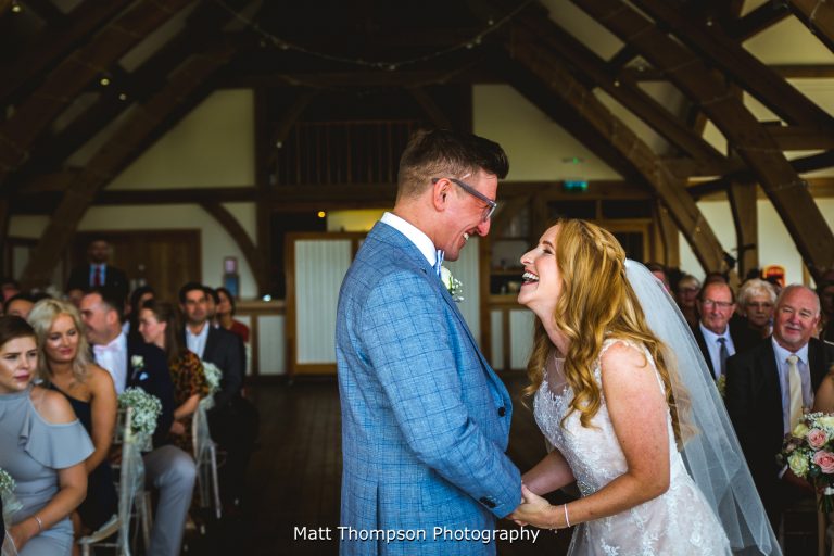bride and groom laughing